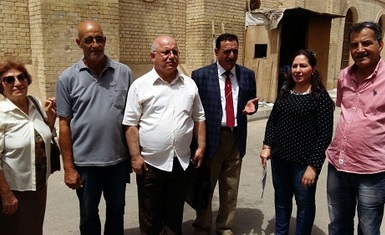 Members of the Iraqi Forum for Human Rights Organizations holding a demonstration on the second anniversary of the Islamic States occupation of Nineveh