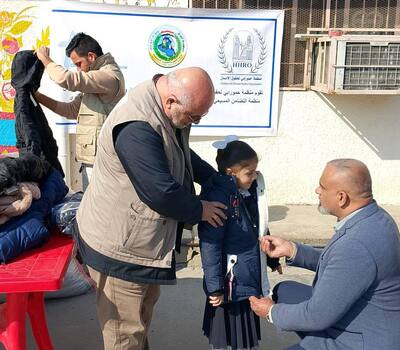 In Sadr City, Baghdad: Hammurabi Organization distributes Winter Clothes to Orphan Schools